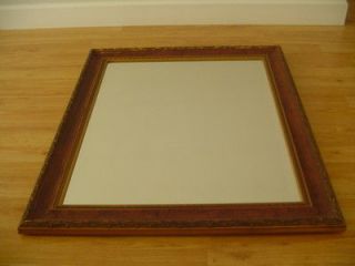 LARGE FRAMED WALL MIRROR. 27.75 W X 33.5 H. BROWN WOODEN FRAME 