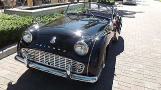   1962 TRIUMPH TR3 B. BLACK WITH RED. SHOWROOM PAINT. BEAUTIFUL CAR