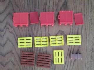 Ten Corgi or Matchbox plastic containers and pallets and a brown box
