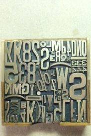   of solid, all brass letterpress letters, numbers and symbols, vintage