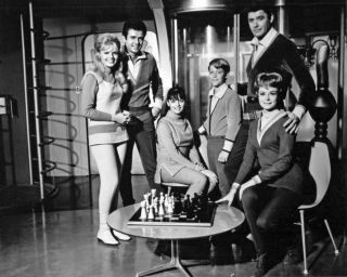Cast of Lost in Space Sitting on the Upper Deck