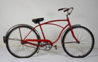 Schwinn vintage bicycle in red with black seat, chrome fenders and 