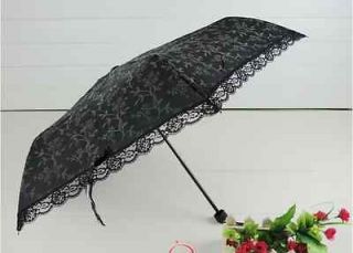 vintage black umbrella in Umbrellas & Parasols