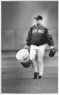 1997 Brian Rose of the Boston Red Sox carrying a bucket of baseballs 
