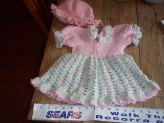 New hand crocheted infant dress with hat never used pink and multi 