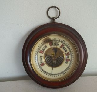 Barometer made in Germany. Wood case with brass frame and glass cover 