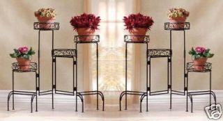 two 4 tier wrought iron plant stand planters stands