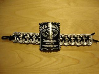METAL CUT OUT,JACK DANIELS BRACELET;MADE OF TABS & LACE;PUT ON 