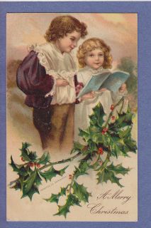 911 christmas holly boy girl reading book clapsaddle time left