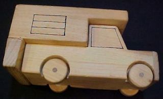 Amateur handmade pickup truck with camper vintage wood toy