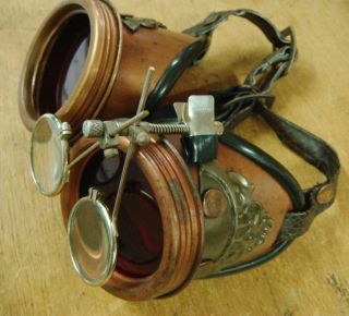 Steampunk handmade rustic goggles with red lens frame detail 