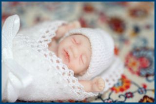 Angelo is an OOAK Baby Boy, hand sculpted with great care from polymer 