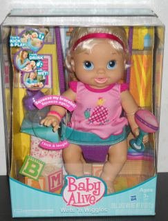 Baby Alive Wets n Wiggles   Interactive Doll   Kick, Play, Drink, and 