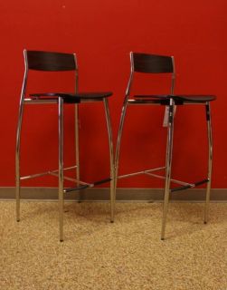 You are bidding on a set of 2 Baba Barstools in good condition. There 