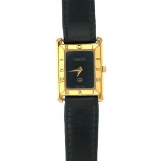 gucci ladies watch black dial shiny hands fixed gold tone bezel 