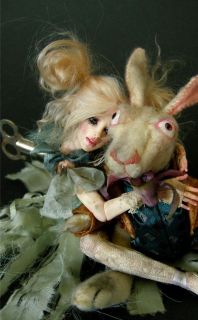 alice and the white rabbit is a polymer sculpture by artist nicole 