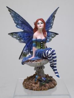 Item AMY BROWN BLUE WINGED FAIRY SITTING IN GARDEN FIGURINE STATUE 