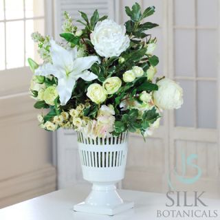   diameter. Flowers used include lily, roses, hydrangeas and greenery