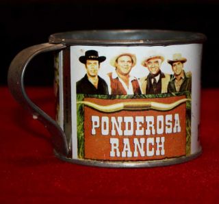 This PONDEROSA RANCH metal cup measures approximately 3 high x 3 1/2 