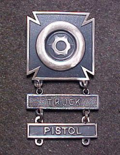RARE WW2 US ARMY DRIVER BADGE WITH TRUCK AND PISTOL BAR MARKED JOSTENS 