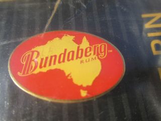 BUNDY BUNDABERG RUM HAT PIN AUSTRALIA BACKGROUND GENUINE OFFICIAL 