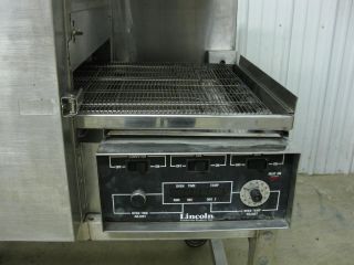   at a Lincoln Impinger electric double stack conveyor pizza oven