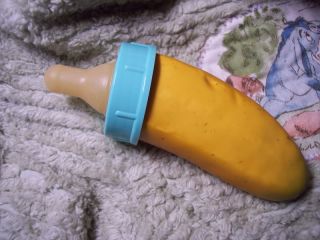   banana bottle with the green cap for your baby girl chimp or orangutan