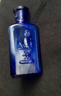 OWN DRUG CO. Cobalt Blue triangular POISON bottle two wing owl 3 1/2