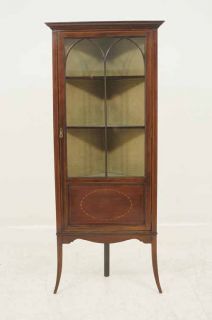 Edwardian mahogany corner cabinet, the projected moulded cornice over