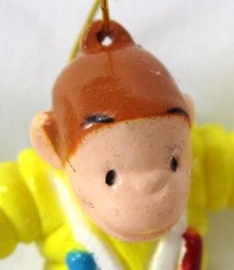  This is a set of three cute Curious George mini Christmas ornaments