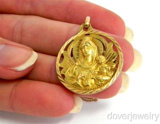 This lovely Vintage virgin mary charm pendant is crafted in solid 18K