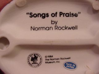Here is a Norman Rockwell figurine titled Songs of Praise. The