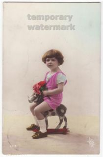 Cute Little Girl Riding Small Wooden Horse c1910s Tinted Photo