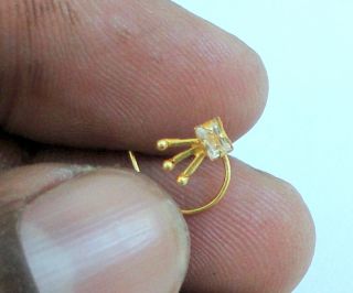 18 K SOLID GOLD NOSE STUD. SIMPLE DESIGN AND SATED SMALL ZIRCON, NICE