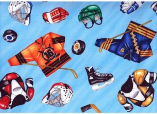 hockey equipment gear on lt blue cotton quilt fabric image shows