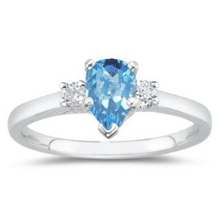 10 Cts Diamond & 4.55 Cts Swiss Blue Topaz Three Stone Ring in 18K