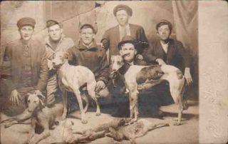 XA265 RPPC Pittsburg KS 1916 Studio Rabbit Hunting Dogs