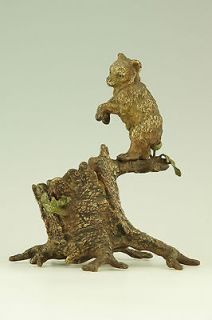 cold painted Vienna bronze bear on a tree trunk by Bergman, Austria