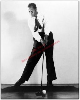 Bobby Jones hits golf ball with a driver {1938} Photo