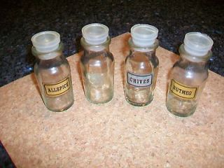 Vintage lot of 4 glass spice jars with plastic tops