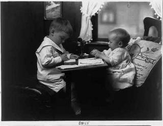 Newly listed Buisy,two small children indoors at desk,1924,one is