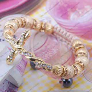 clear crystal twist gold tone cross connector bracelet beige cord bead