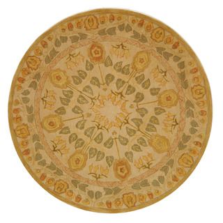 Handmade Ancestral Tree Ivory/ Green Wool Rug (6 Round) (IvoryPattern OrientalMeasures 0.625 inch thickTip We recommend the use of a non skid pad to keep the rug in place on smooth surfaces.All rug sizes are approximate. Due to the difference of monitor