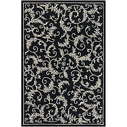 Hand tufted Mandara Black Wool Area Rug (79 X 106) (BlackPattern FloralMeasures 0.75 inch thickTip We recommend the use of a non skid pad to keep the rug in place on smooth surfaces.All rug sizes are approximate. Due to the difference of monitor colors,