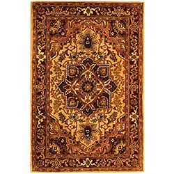 Handmade Classic Heriz Gold/ Red Wool Rug (4 X 6) (GoldPattern OrientalMeasures 0.625 inch thickTip We recommend the use of a non skid pad to keep the rug in place on smooth surfaces.All rug sizes are approximate. Due to the difference of monitor colors